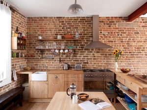 Contemporary-kitchen-in-London-with-brick-walls-and-wooden-workstation